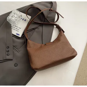 Vintage brown embossed shoulder bag for women, stylish underarm hobo bag with strap.