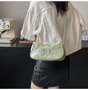 Light green motorcycle shoulder bag for women, vintage style underarm bag with metal buckles.