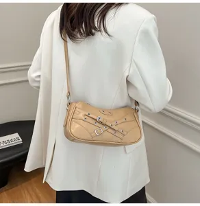 Motorcycle style leather shoulder bag for women, chic buckle strap crossbody bag.