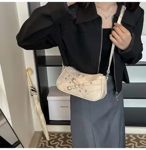 Retro PU leather motorcycle shoulder bag with buckle straps for women stylish underarm bag.