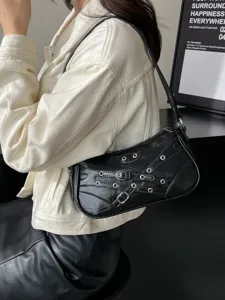 Black motorcycle shoulder bag with metal buckles and studs, stylish chic hobo handbag for women.