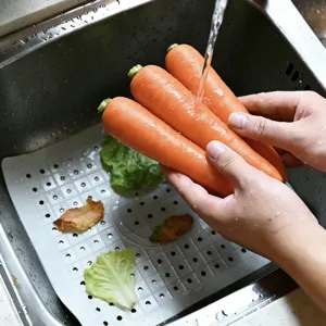 Silicone sink draining mat detail, featuring perforated design for kitchen sink use.