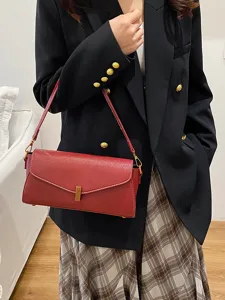 Chic red shoulder bag for women, stylish underarm crossbody bag with metal lock design daily use.