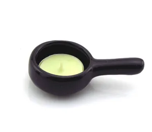 Black ceramic candle holder detail, aroma burner for relaxing tealight and spa use.