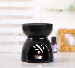 Black ceramic oil burner large aroma diffuser for essential oils, modern home fragrance tool.