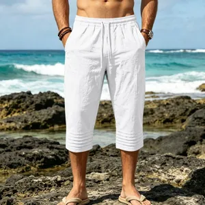 Men's white drawstring cropped trousers, casual beach shorts with pleated cuffs.