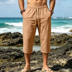 Men's casual linen capri shorts with drawstring waist and pleated hem for summer beach vacation.