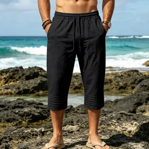 Mens black cropped beach shorts with casual drawstring waist and detailed pleats.