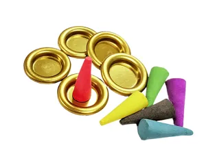 Metal incense tray and colorful tower incense cone details for aroma therapy setup.
