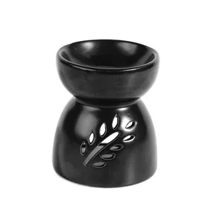 Black ceramic essential oil burner with leaf cutout design for aromatherapy and home fragrance.