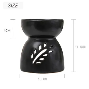 Black ceramic oil burner with leaf cutout design, large capacity aroma diffuser, 11.5cm height.