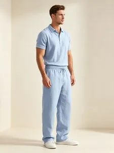 Men casual light blue cotton linen polo shirt and loose trousers detail view for summer.