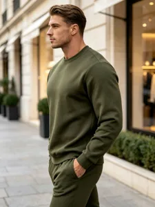 Detailed view of the stylish olive green men's casual crewneck sweatshirt in urban scene.