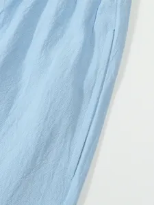 Light blue casual linen shorts fabric detail close-up showing soft texture and side pocket seam.
