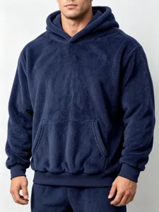 Detailed close-up view of the dark blue plush fleece hooded sweatshirt with front pocket.