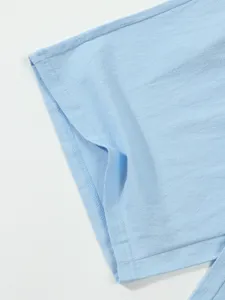Light blue casual linen blend clothing sleeve detail close up, showing fine stitching work.