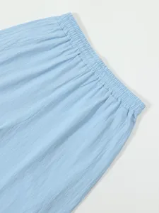 Detailed view of light blue men's casual linen shorts with comfortable elastic waistband.