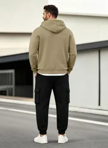 Detail view of men's fleece-lined hooded sweatshirt and cargo pants set for casual wear.