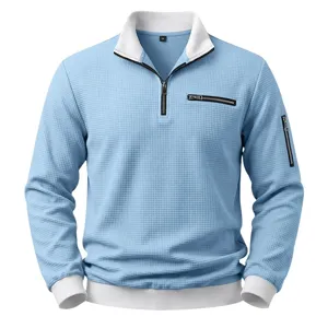 Detailed view of men's quarter-zip waffle knit sweatshirt in light blue with contrast collar.