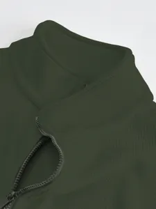 Detailed view of dark green ribbed high collar on mens winter fleece lined jacket top.