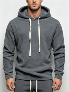 Detail view of men's dark gray fleece cozy hoodie with contrast white drawstrings and cuffs.