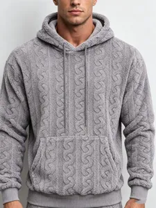 Close-up of mens gray fleece hoodie detail, soft cable knit texture, warm winter wear item.