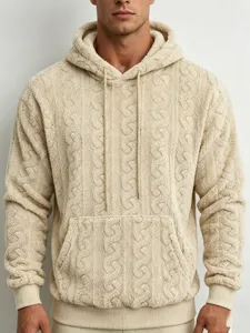 Close-up detail of men beige teddy fleece cable knit hoodie, soft fuzzy textured streetwear.