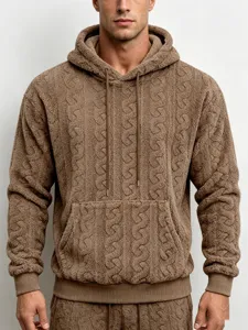Cozy brown teddy fleece cable knit hoodie detail featuring a soft texture, drawstring hood and pocket.