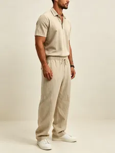Men's casual linen polo shirt and loose pants set, breathable summer streetwear outfit.