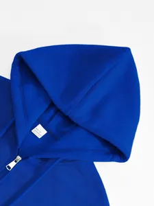 Men's royal blue zip-up hooded sweatshirt detail shot, comfortable casual daily wear.