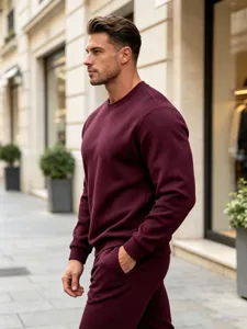 Detailed view of solid burgundy men crewneck sweatshirt, heavy fabric texture for winter streetwear.