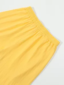 Close-up detail of men's summer casual linen shorts elastic waistband fabric texture shot.