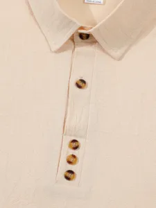 Men's solid color linen-texture long sleeve shirt detail, classic lapel collar and buttons.