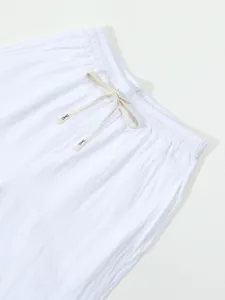 White casual shorts waist detail, drawstring elastic waistband, close-up product view.