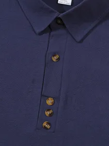 Men's long sleeve solid color business casual linen blend shirt collar detail view.