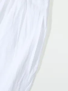 Close up detail of white linen casual shorts side pocket, breathable summer menswear.
