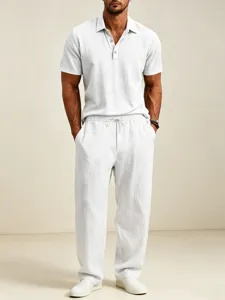 Men's white casual cotton linen short sleeve polo shirt and loose long pants set for summer.