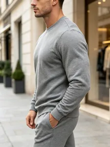 Men's casual grey crewneck sweatshirt detail shot showing simple solid color fabric texture.