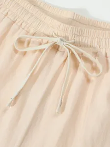 Detailed close-up view of the casual linen shorts elastic waistband and adjustable drawstring.