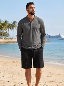 Men waffle long sleeve polo shirt and shorts set detail view in beach scene for casual wear.
