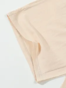 Close up of men's summer linen fabric clothing detail, showing fine stitching texture.
