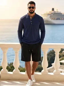 Detailed view of men's waffle knit long sleeve polo and shorts set worn by model outdoors.