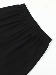 Close-up of black men's casual shorts elastic waistband, featuring soft and breathable fabric.