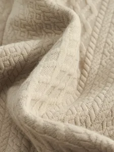 Detailed view of the premium men jacquard knit fabric showing fine texture and soft feel.