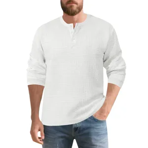 Close-up of white waffle texture long sleeve Henley shirt with button placket detail.