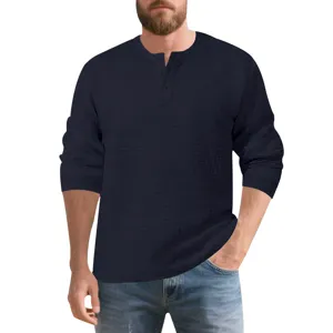 Detail shot of textured waffle long sleeve Henley shirt in navy blue for men.