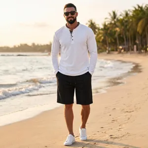Men's waffle long-sleeve polo shirt and shorts casual set worn by a model on a beach.