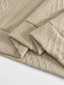 Men's casual suit jacquard fabric detail close up, premium textured knit material view.