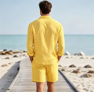 Detailed view of men yellow linen shirt and shorts set on a beach boardwalk scene.