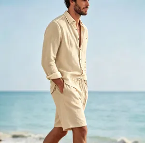 Detailed view of men's casual linen shirt and shorts set worn by a model at the sunny beach.